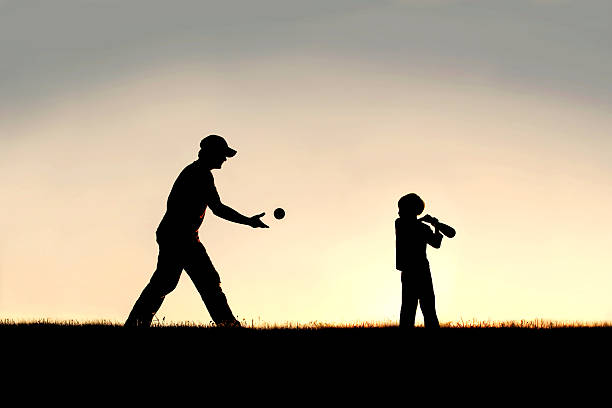 シルエットの父親子供外遊びの野球 - baseball baseballs ball isolated ストックフォトと画像