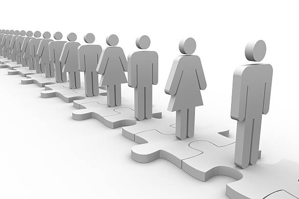 istock Line of white human forms standing over meshed jigsaw pieces 476304595
