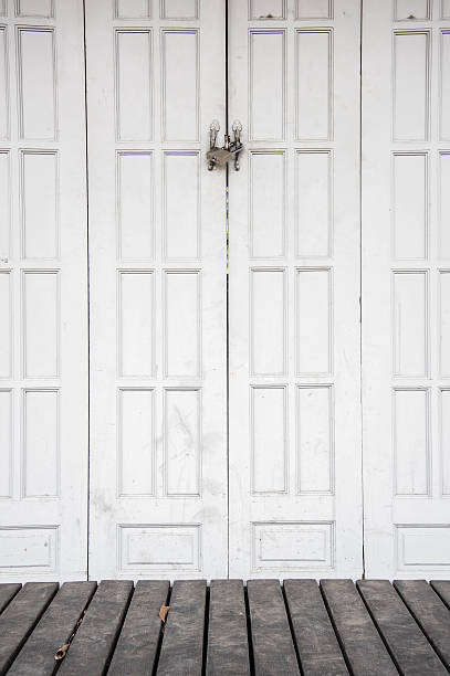 istock white wooden door and black floor 476304928