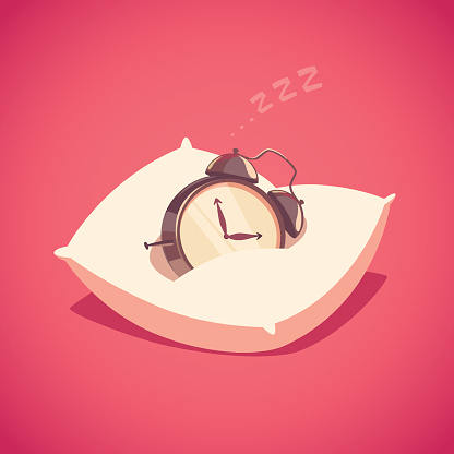 Alarm clock is sleeping on the pillow. Isolated object  background.