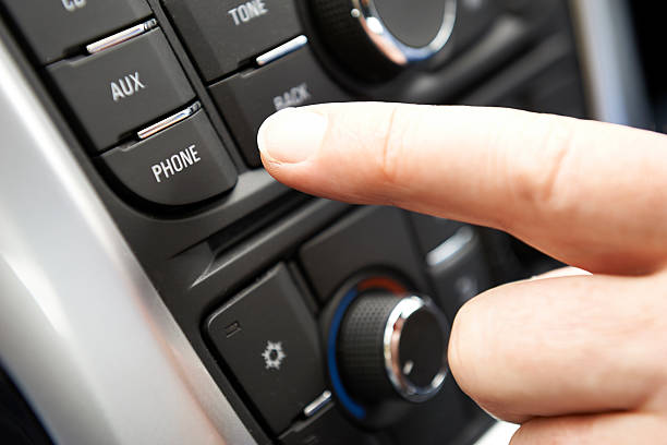istock Close Up Of Hand Pressing Car Bluetooth Control On Dashboard 476308466