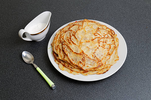 istock Frying homemade pancakes with sour cream 476308878