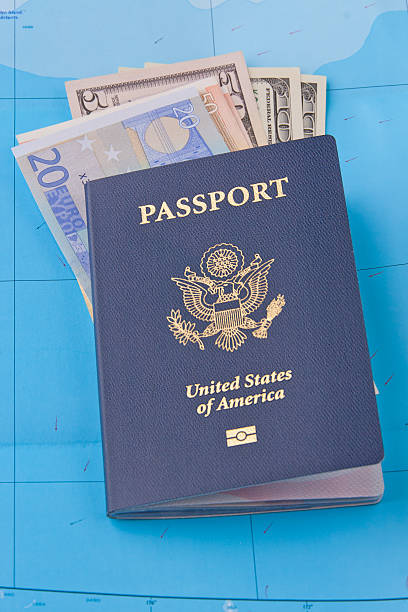 istock American passport, euros  and dollars on map background for trav 476311771