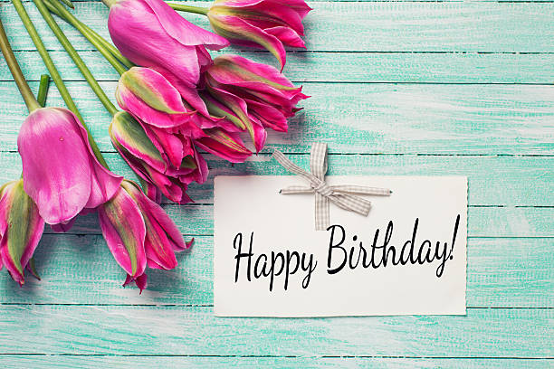 istock Background with fresh  bright pink tulips flowers and empty tag 476312268