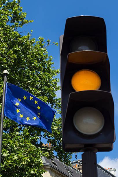 istock Yellow light and European Union flag 476312750