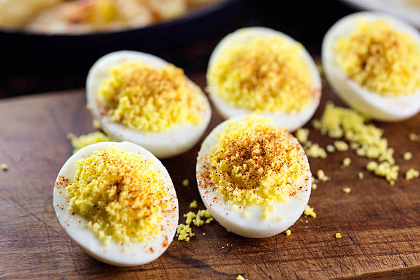 Deviled Eggs Deviled Eggs close up with paprika Deviled Egg stock pictures, royalty-free photos & images