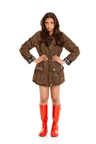 istock Young girl wearing coat and gumboots looking upset 476317521