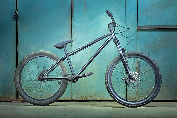 istock Black bicycle on a background green garage with light effects 476320270