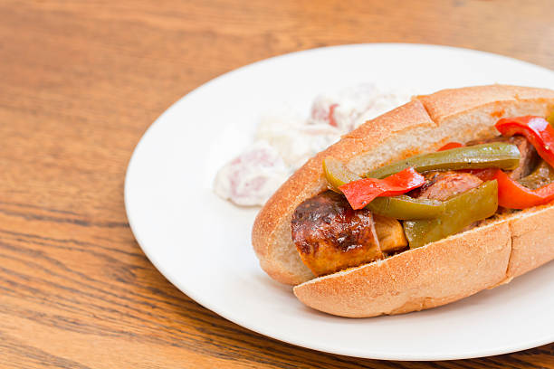 Sausage Onion Peppers Bun Fried sausage onions and red and green bell peppers on sandwich bun torpedo sandwich stock pictures, royalty-free photos & images