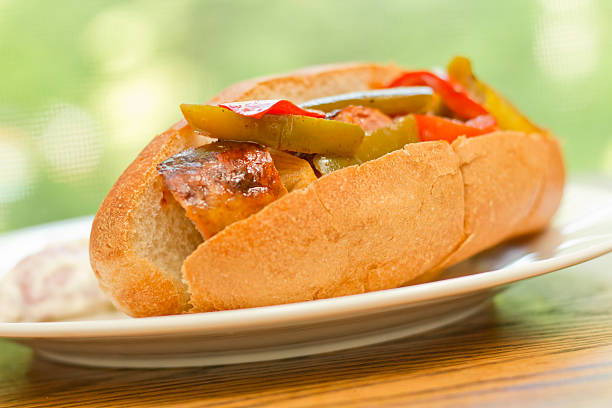 Sausage Onion Peppers Bun Fried sausage onions and red and green bell peppers on sandwich bun torpedo sandwich stock pictures, royalty-free photos & images