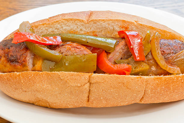 Sausage Onion Peppers Bun Fried sausage onions and red and green bell peppers on sandwich bun torpedo sandwich stock pictures, royalty-free photos & images