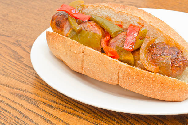 Sausage Onion Peppers Bun Fried sausage onions and red and green bell peppers on sandwich bun torpedo sandwich stock pictures, royalty-free photos & images