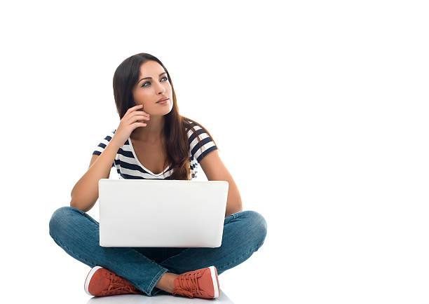 istock Young beautiful woman using laptop 476321927