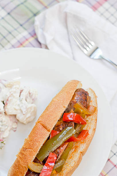Sausage Onion Peppers Bun Fried sausage onions and red and green bell peppers on sandwich bun torpedo sandwich stock pictures, royalty-free photos & images