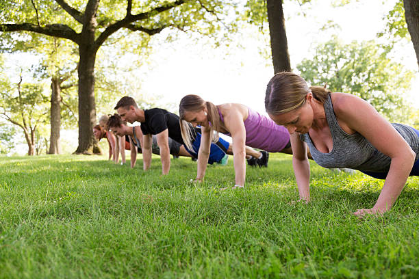 istock Group of People Exercising in the Park 476323374