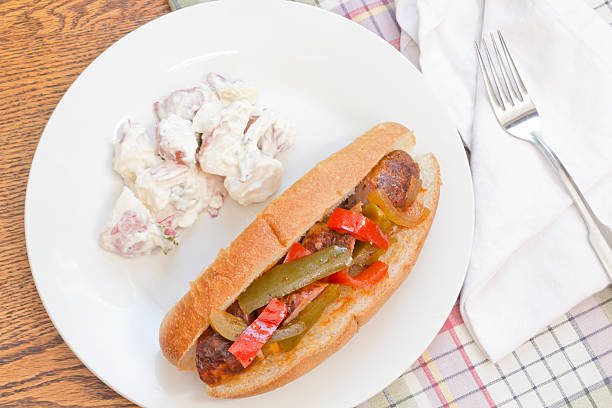 Sausage Onion Peppers Bun Fried sausage onions and red and green bell peppers on sandwich bun torpedo sandwich stock pictures, royalty-free photos & images
