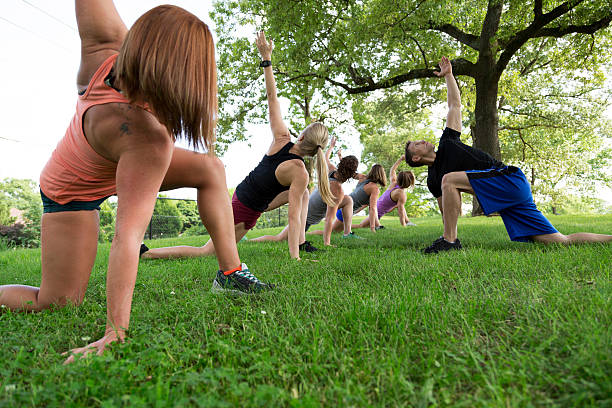 istock Group of People Exercising in the Park 476323520