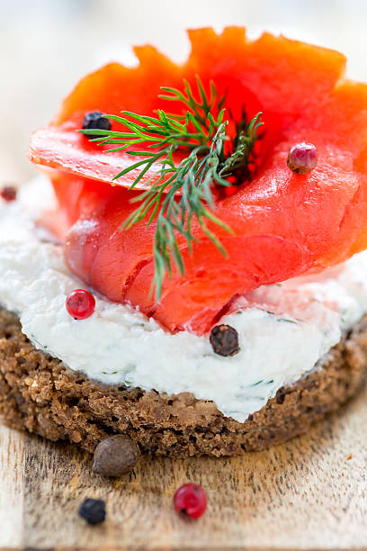 istock Sandwich with red salmon, cheese and dill. 476324600