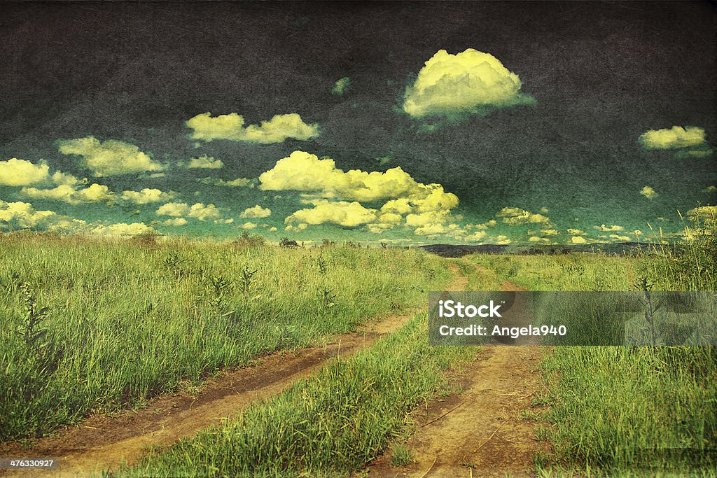 Peaceful landscape with country road, retro styled photo Peaceful rural landscape with country road, retro styled photo Agricultural Field Stock Photo