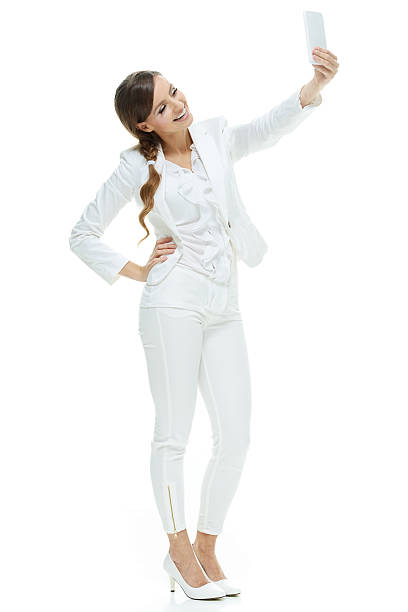 istock Smiling businesswoman taking a selfie 476331916