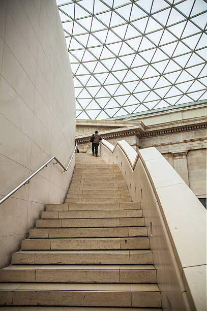 London, UK - November 30, 2014: British museum main hall interior with library building in the inner yard.
