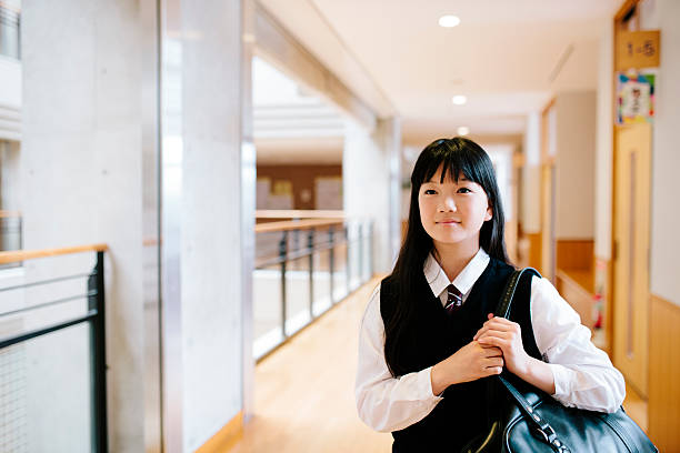 istock Japanese high school. Young student carrying a shoulder bag 476332472