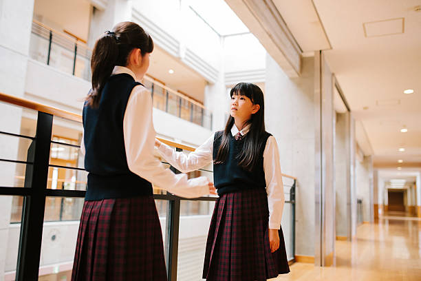 istock Japanese high school. Students chat, first floor corridor, overlooking atrium 476332474