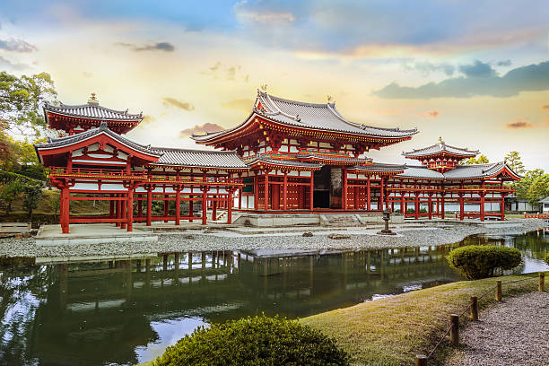 The Phoenix Hall of Byodo-in Temple in Kyoto Kyoto, Japan - October 21 2014: Byodoin temple built in 998 AD during the Heian period, originally a private residence and converted into a temple by a member of the Fujiwara clan in 1052 heian period stock pictures, royalty-free photos & images