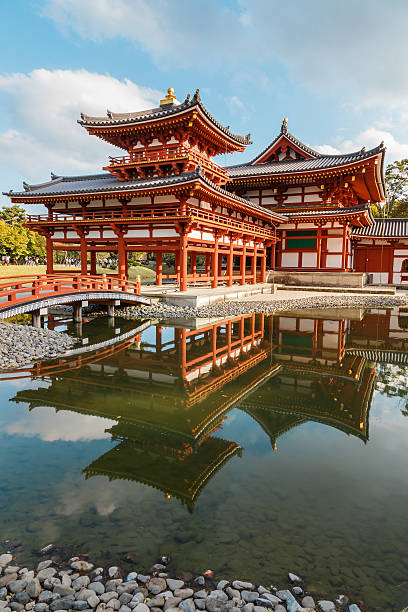 The Phoenix Hall of Byodo-in Temple in Kyoto Kyoto, Japan - October 21 2014: Byodoin temple built in 998 AD during the Heian period, originally a private residence and converted into a temple by a member of the Fujiwara clan in 1052 heian period stock pictures, royalty-free photos & images