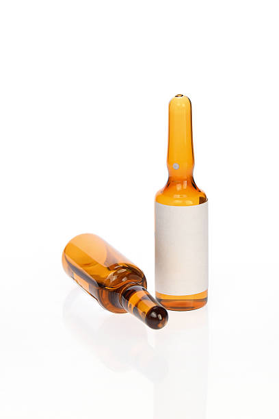 istock medical ampoules on white background 476342872