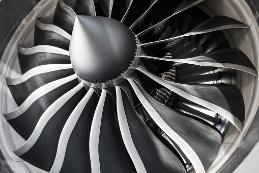 Zürich, Switzerland - March 08, 2015: Detail of fan blades and inlet guide vanes of a General Electric GEnx engine at Zurich Airport. The General Electric GEnx (General Electric Next-generation) is an advanced dual rotor, axial flow, high-bypass turbofan jet engine in production by GE Aviation for the Boeing 787 and 747-8.