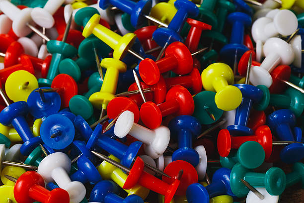 istock piles of plastic pins 476350785