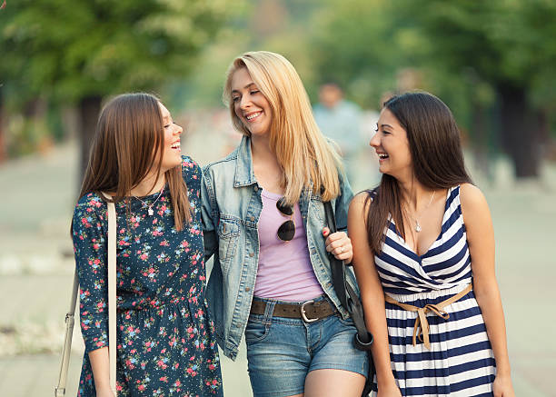 istock Three young women relaxing in the city. 476351155