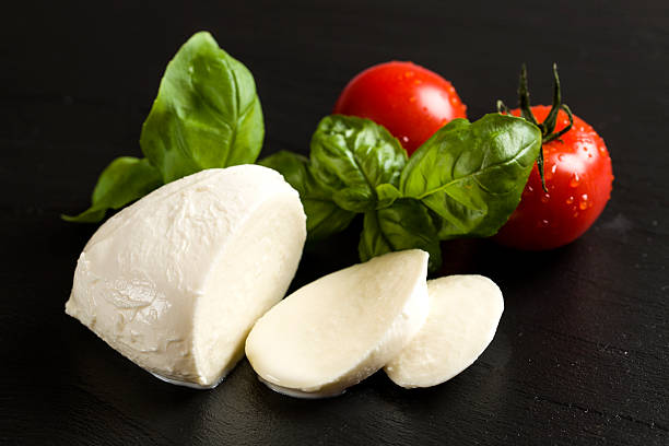 Mozzarella with tomatoes and fresh basil stock photo