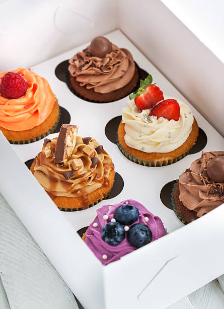istock Set of different  cupcakes in a box 476352424