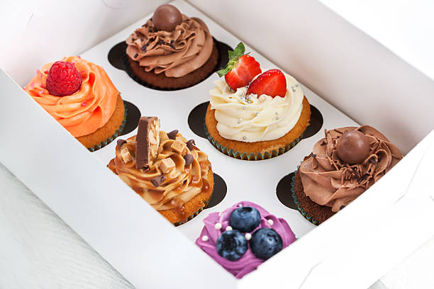 istock Set of different  cupcakes in a box 476352426