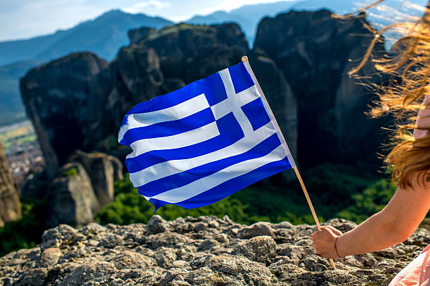 istock Woman with greek flag 476352456