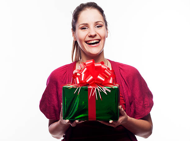 istock Young beautiful woman with present 476354744