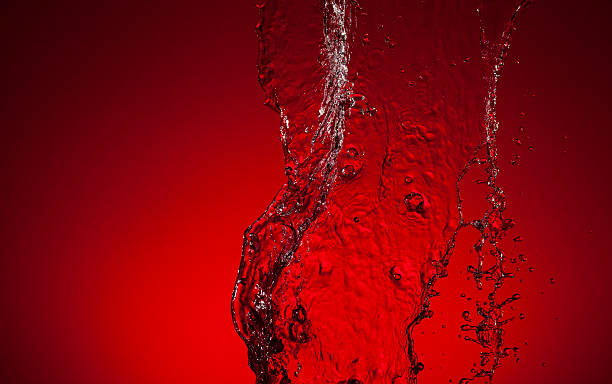 istock Texture of water on a red background 476354840
