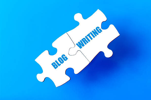 istock Connected puzzle pieces with words BLOG and WRITING 476355514