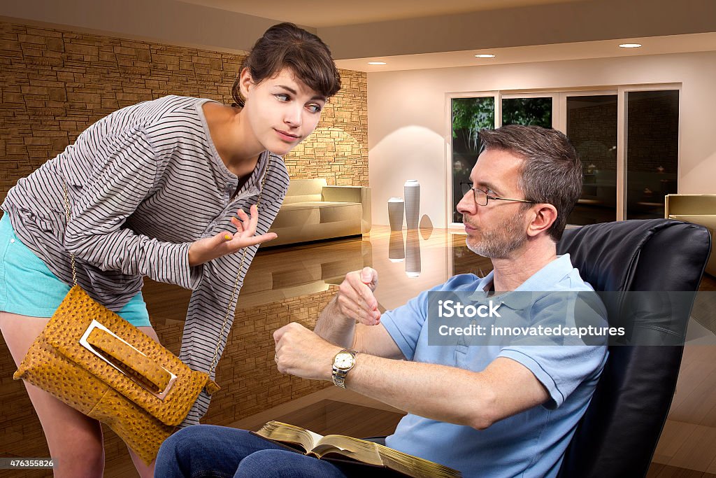 Daughter Coming Home Late At Night Past Curfew Single father waiting for daughter to come home late at night past curfew.  The father is tired of waiting for his teenage daughter. The background depitcs that it is late at night.  The daughter is being irresponsible.  The image depicts problems with parenthood.   Adolescence Stock Photo