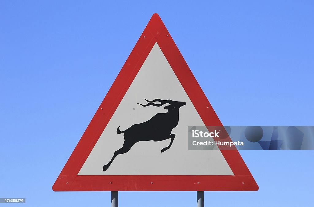 Cartello stradale-Avviso Kudu Crossing - Foto stock royalty-free di Allerta