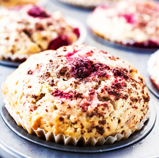 istock Macro Photo of Cherry muffins with chocolate sprinkles in baking 476360441