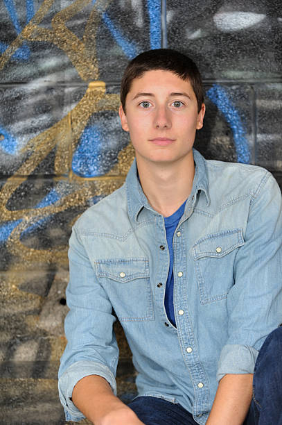 istock Teenage Boy on Grafitti Background, Copy Space 476361523