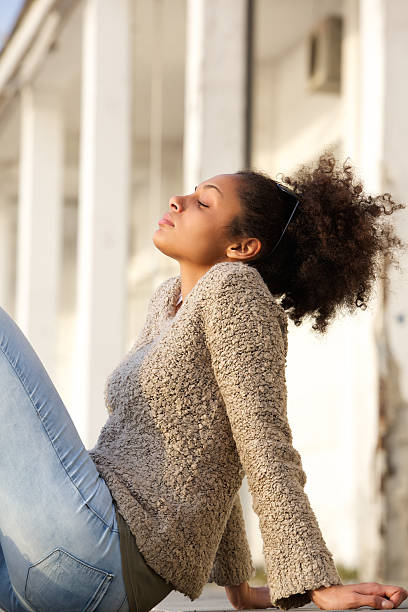 istock Young woman relaxing outside 476362408