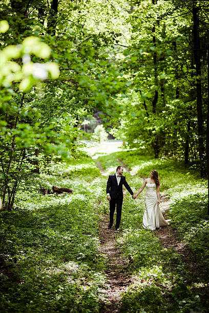 istock Groom and bride in May in the spring forest 476362414