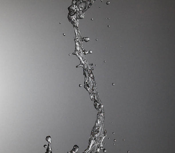istock Stream of water on a silver background 476364478