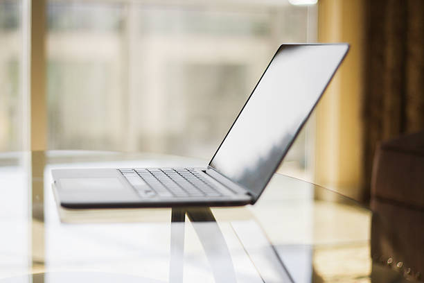 istock modern laptop in a room at sunset 476365598