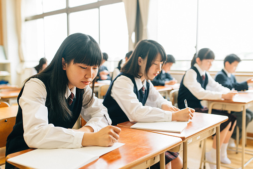 Japanese Junior High School Students filling an exam.