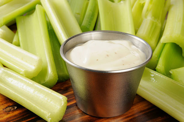 Celery and Ranch Dressing Fresh cut celery sticks and a dish of Ranch dressing dip ranch dressing stock pictures, royalty-free photos & images